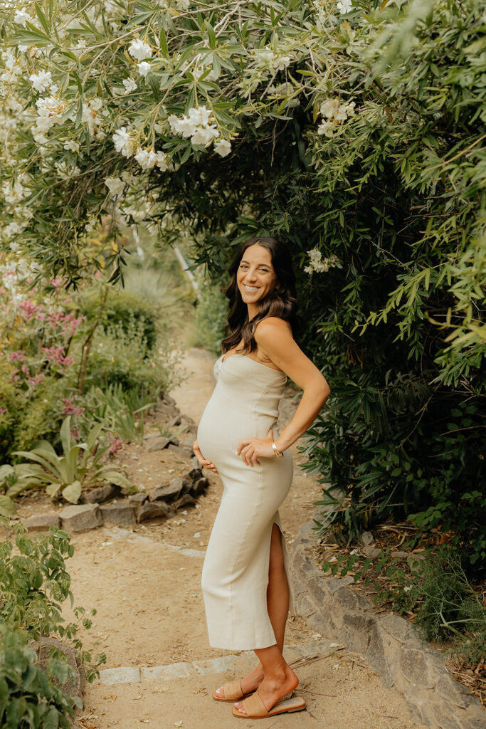 Pregnant mother holding her belly for photoshoot