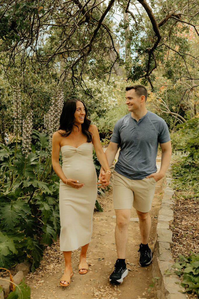 Couple walking through garden 