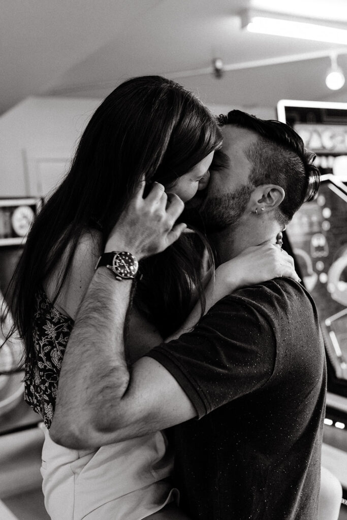 Couple playing skee ball at an arcade
