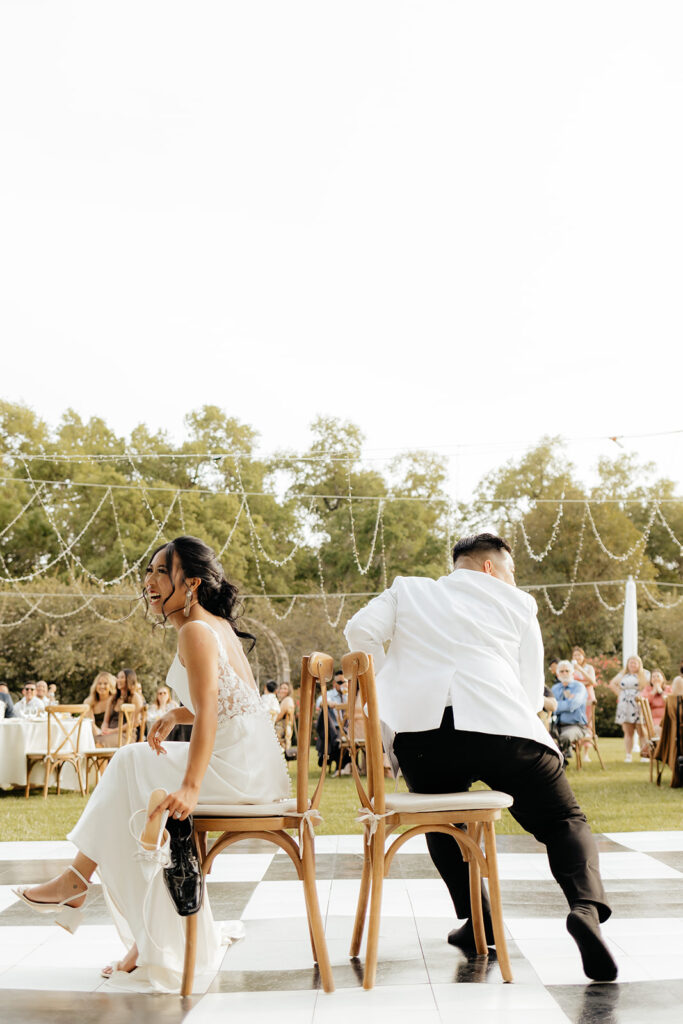 Bride and groom playing reception games