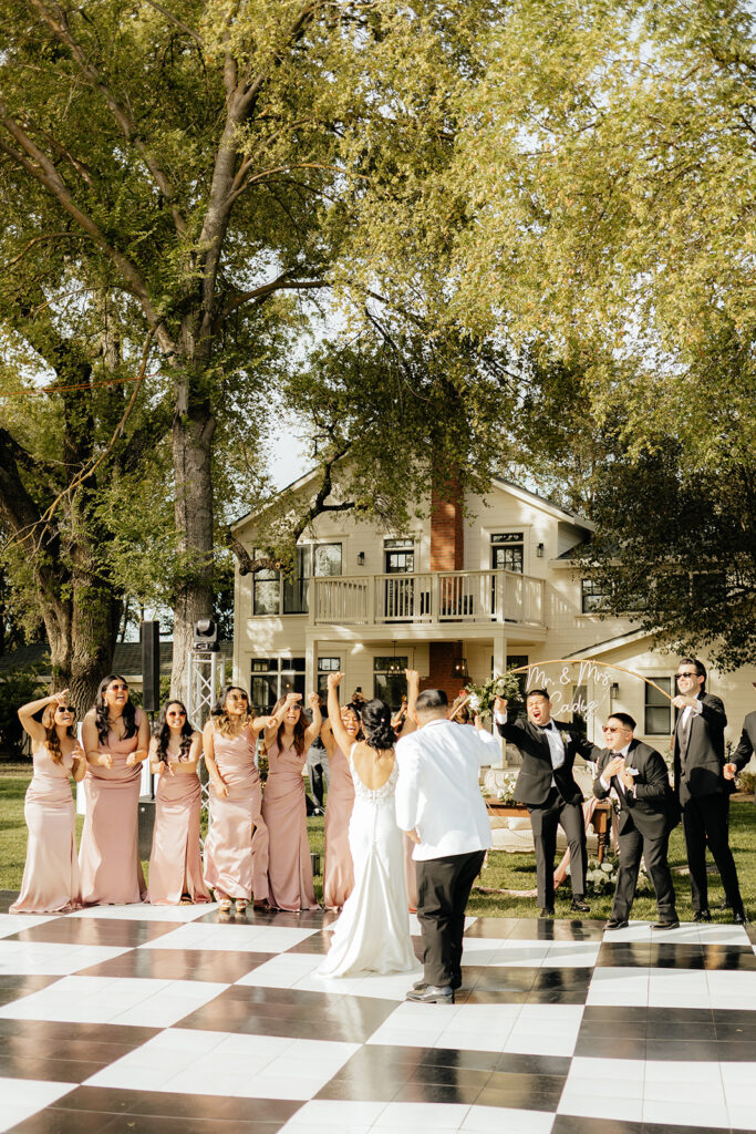 Bride and groom entering reception
