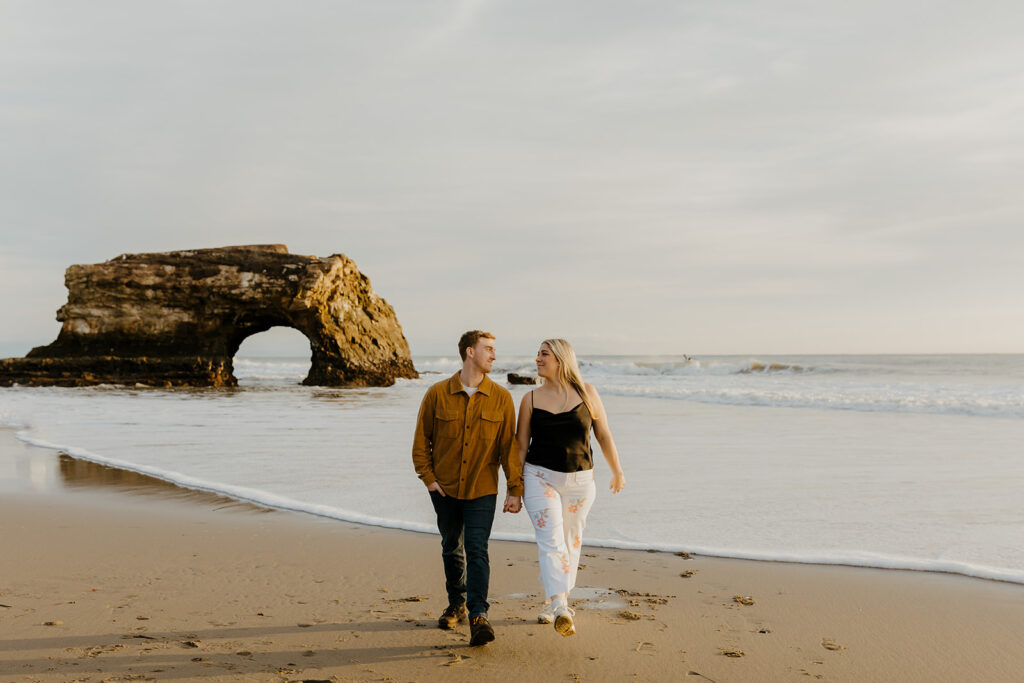 Casual sunset engagement photos at Natural Bridges State Beach in Santa Cruz, CA