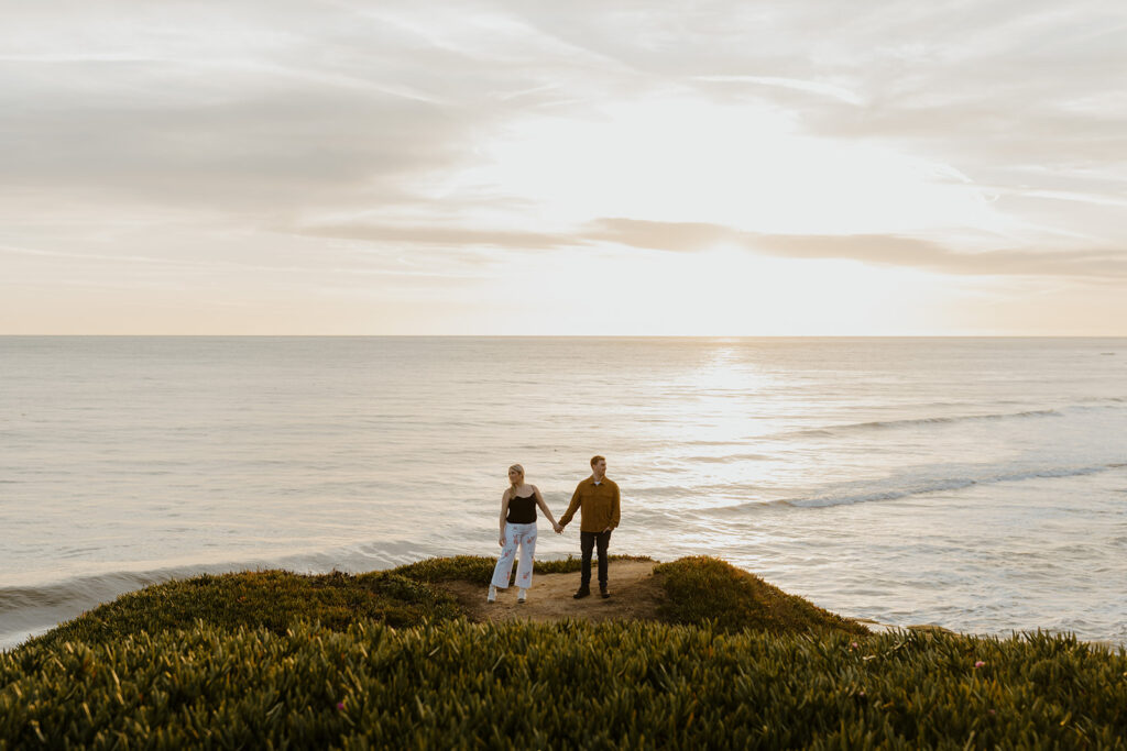 Casual sunset engagement photos at Natural Bridges State Beach in Santa Cruz, CA