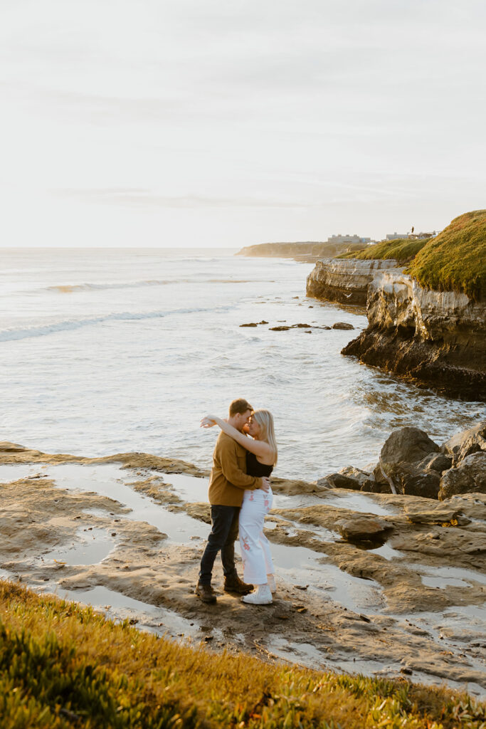 Casual sunset engagement photos at Natural Bridges State Beach in Santa Cruz, CA