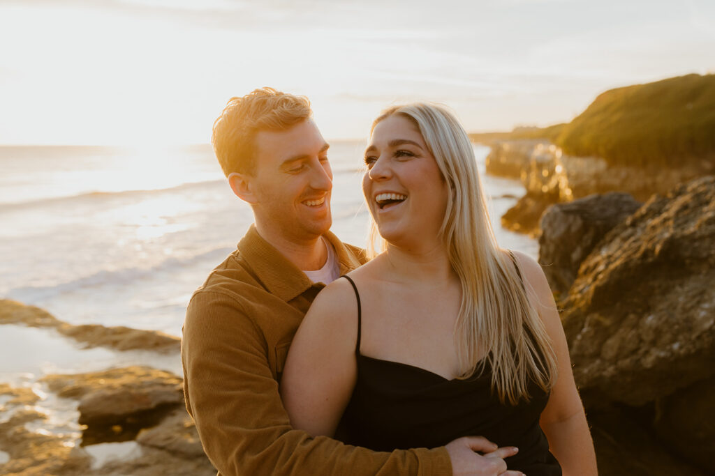 Casual sunset engagement photos at Natural Bridges State Beach in Santa Cruz, CA