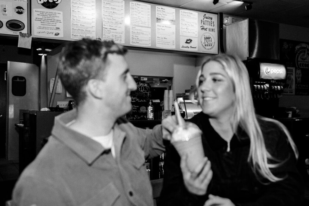 Playful couples photos at the original Betty's Burgers in Santa Cruz, CA