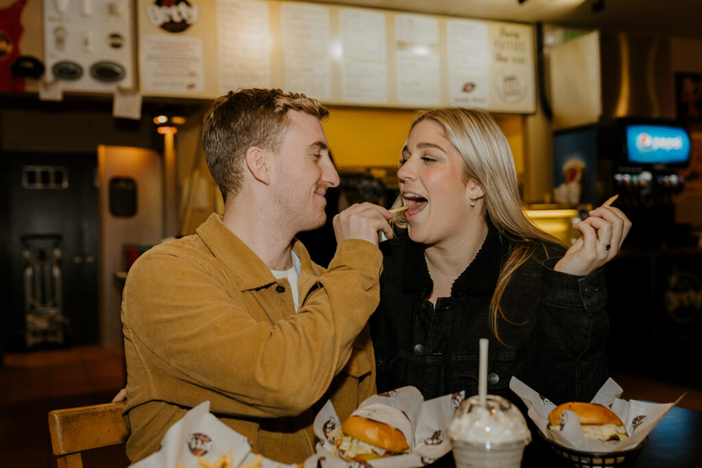 Playful couples photos at the original Betty's Burgers in Santa Cruz, CA
