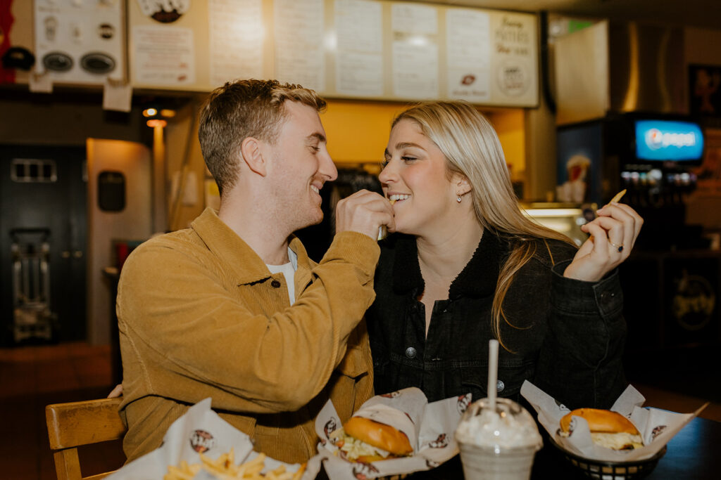 Playful couples photos at the original Betty's Burgers in Santa Cruz, CA