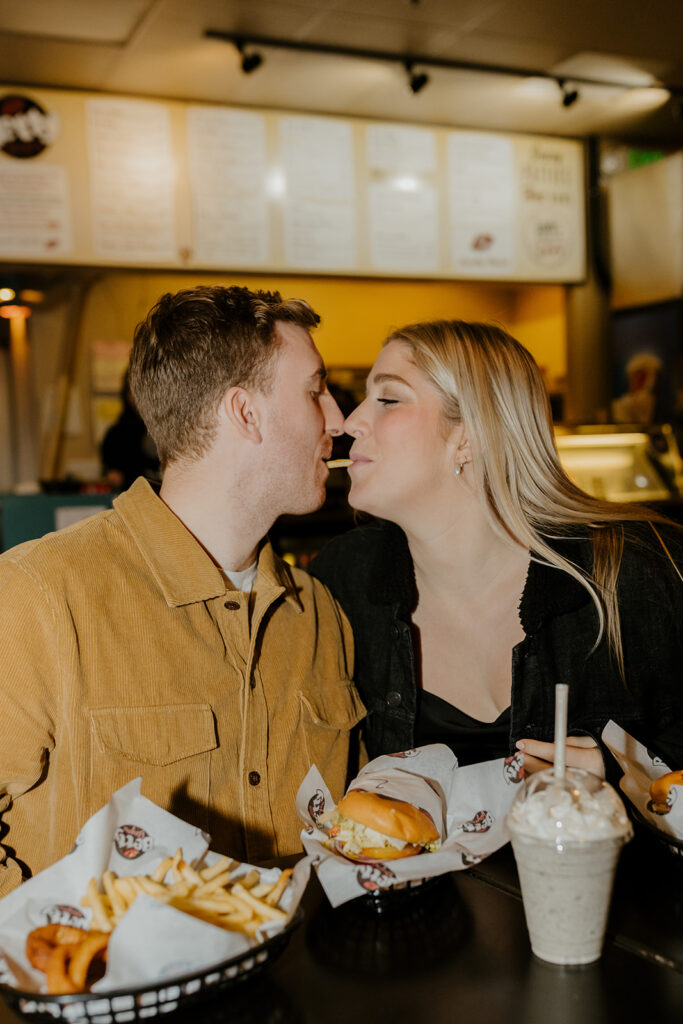 Playful couples photos at the original Betty's Burgers in Santa Cruz, CA