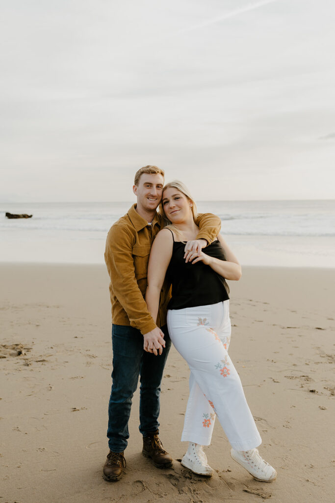 Casual sunset engagement photos at Natural Bridges State Beach in Santa Cruz, CA