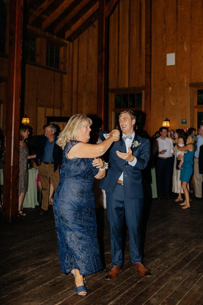 Groom dancing with mother