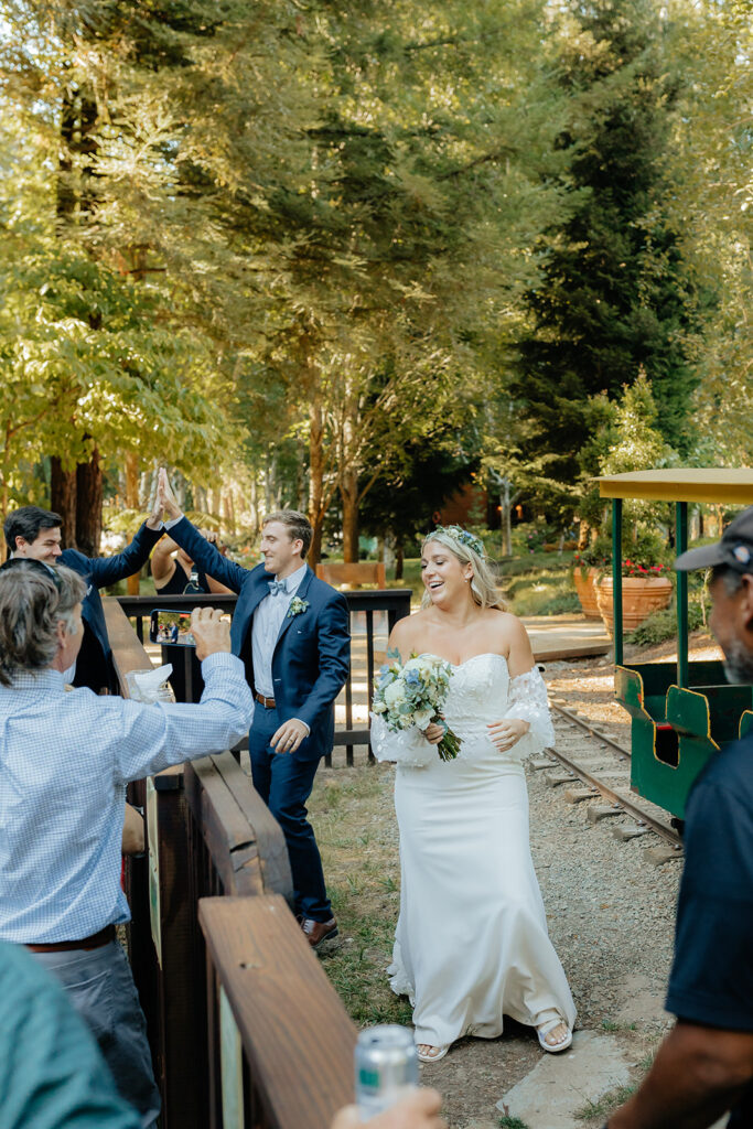 Bride and groom entering reception