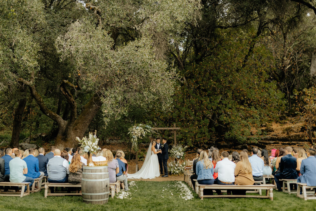 An outdoor ceremony from a glamping wedding weekend at The Ranch at Stoney Creek