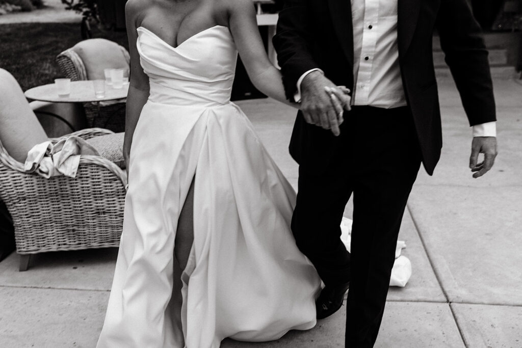 Bride and groom entering reception