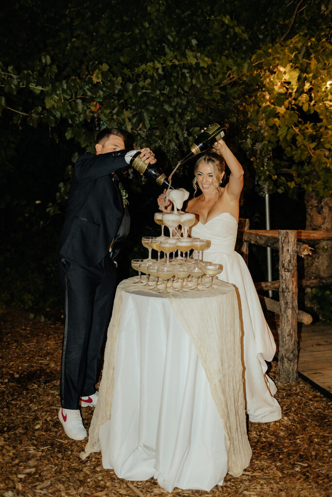 Bride and groom doing champagne tower