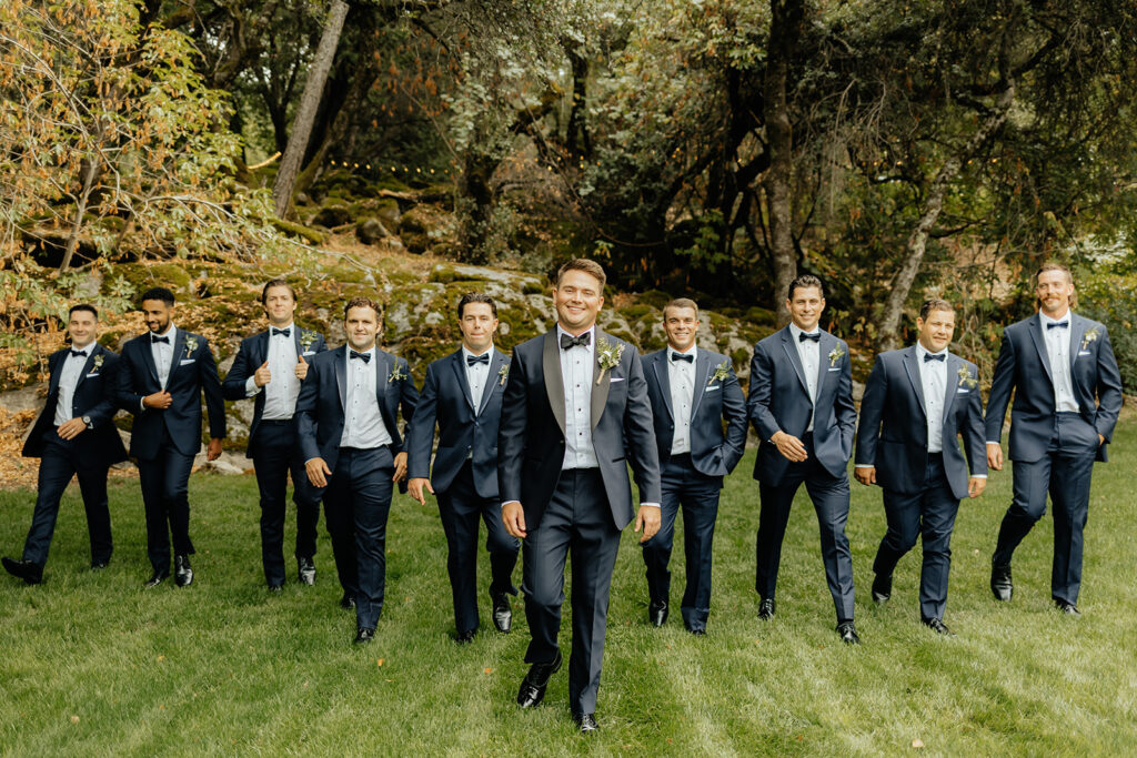 Groom and groomsmen photos from a glamping wedding weekend at The Ranch at Stoney Creek