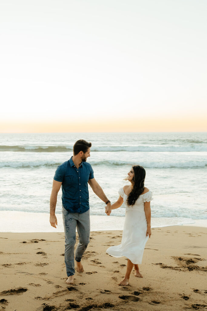 Couples Half Moon Bay engagement photos on the beach