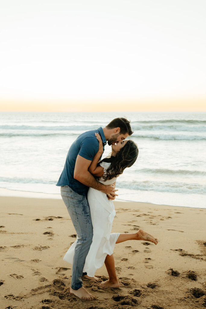 Couples Half Moon Bay engagement photos on the beach