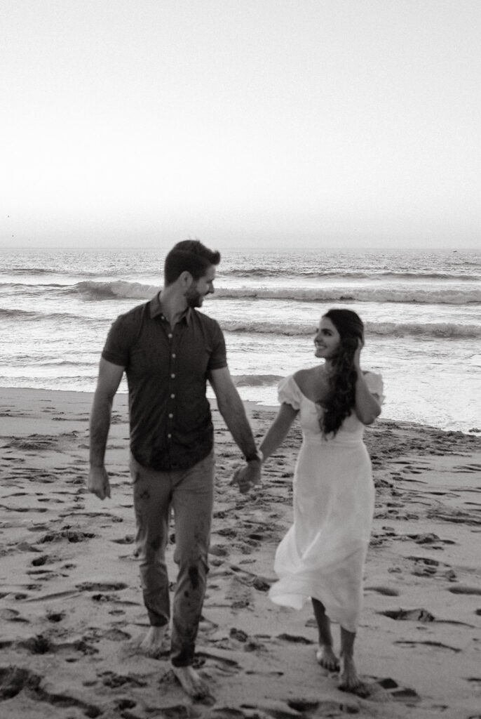 Couples Half Moon Bay engagement photos on the beach