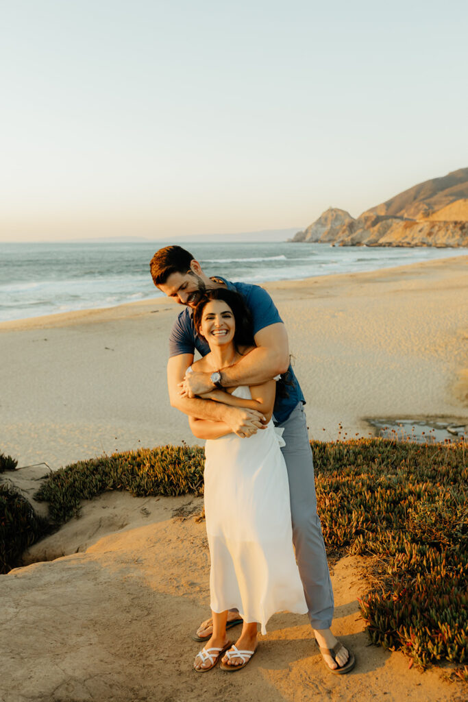 Couples Half Moon Bay engagement photos on the beach