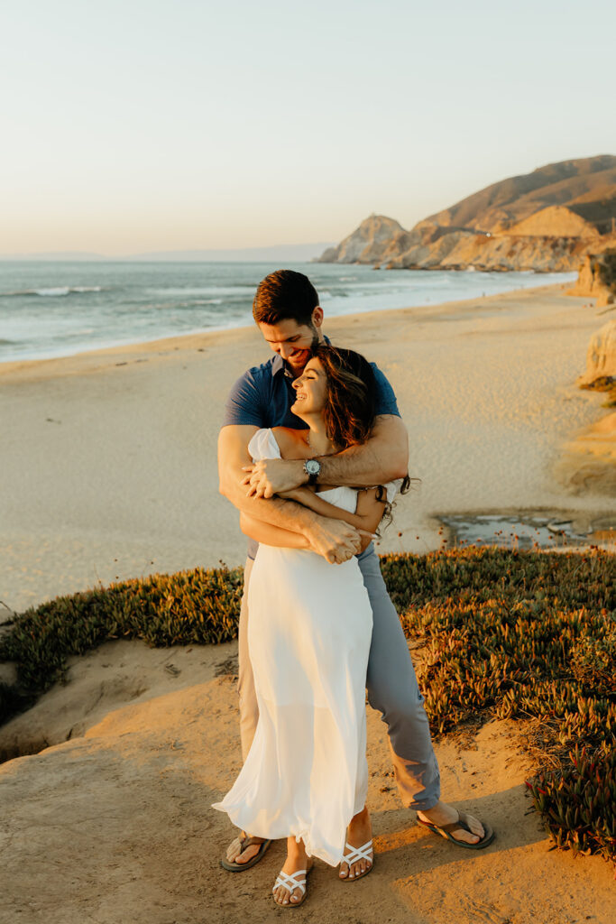 Couples Half Moon Bay engagement photos on the beach