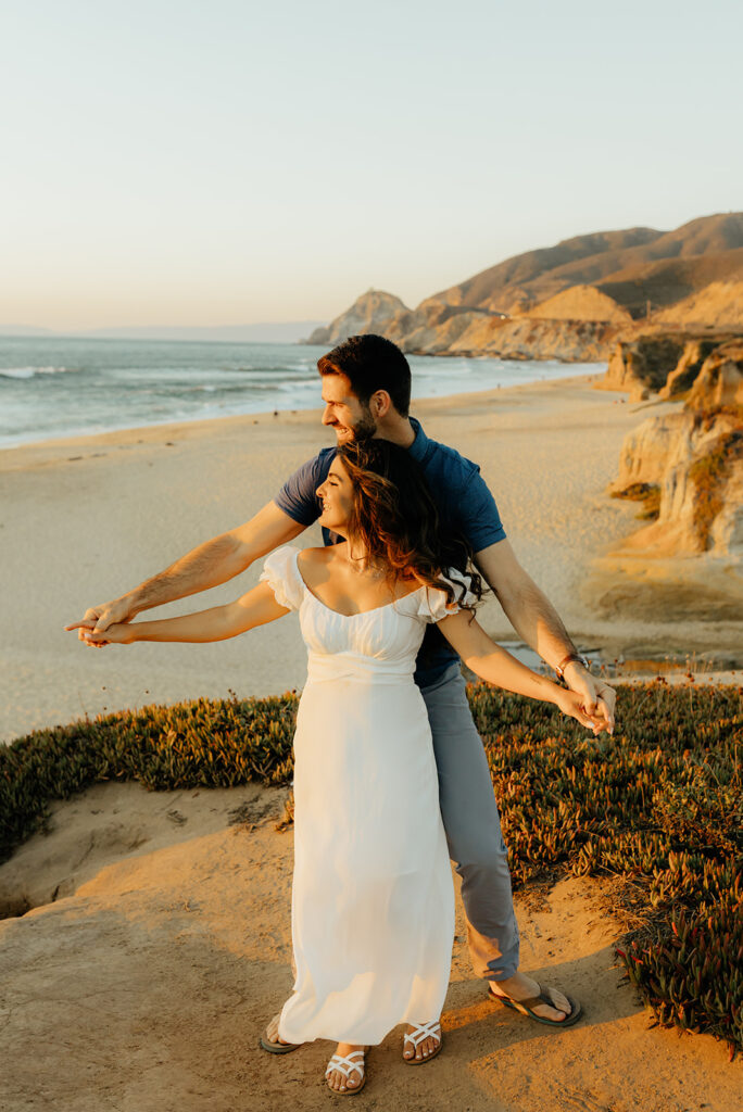 Couples Half Moon Bay engagement photos on the beach