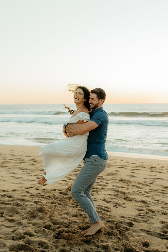 Couples Half Moon Bay engagement photos on the beach