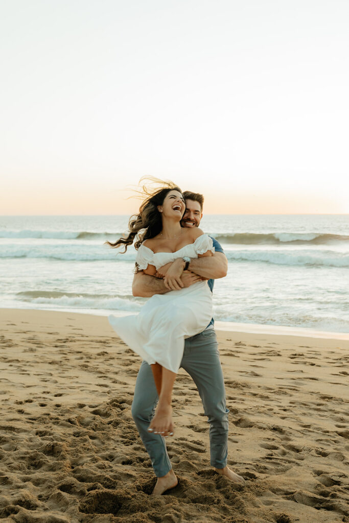 Couples Half Moon Bay engagement photos on the beach