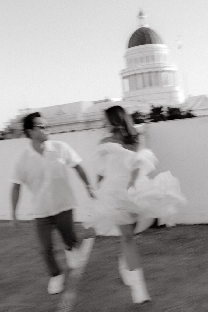 Playful couples rooftop downtown engagement photos in Sacramento