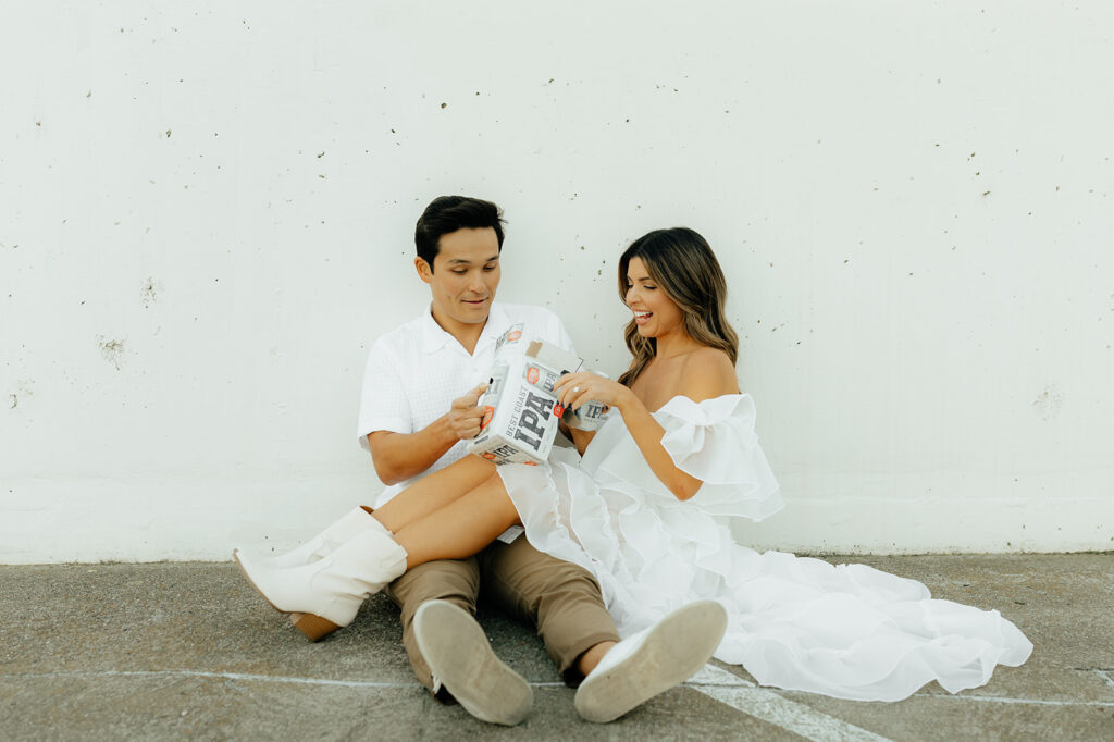 Playful couples rooftop downtown engagement photos in Sacramento