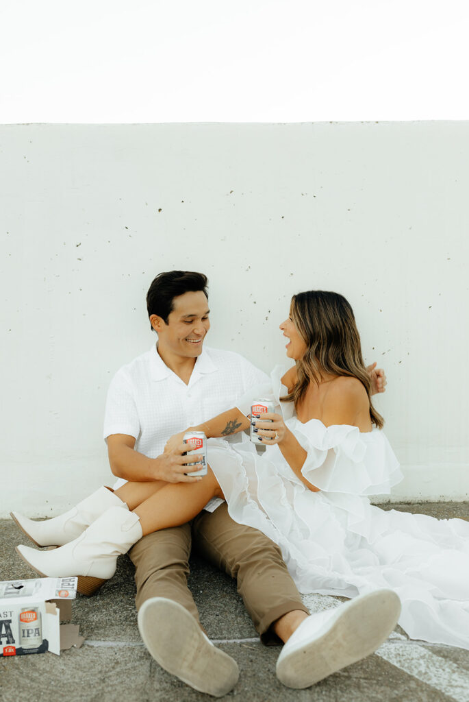 Playful couples rooftop downtown engagement photos in Sacramento