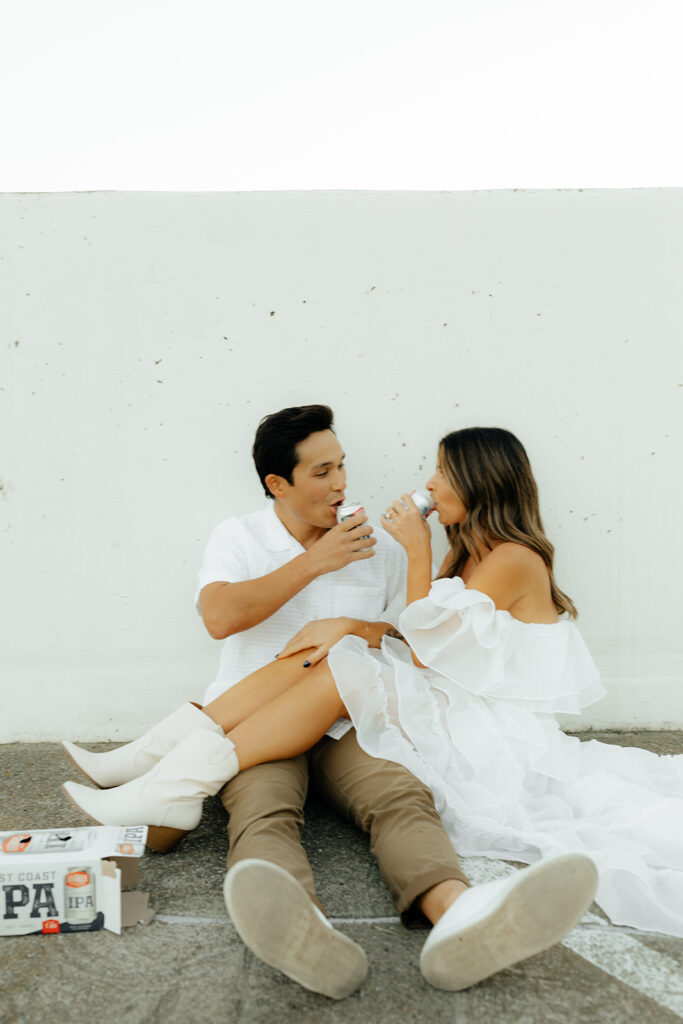 Playful couples rooftop downtown engagement photos in Sacramento