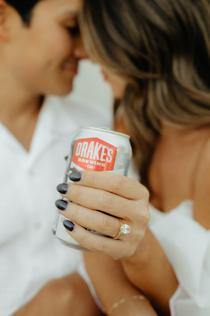 Playful couples rooftop downtown engagement photos in Sacramento