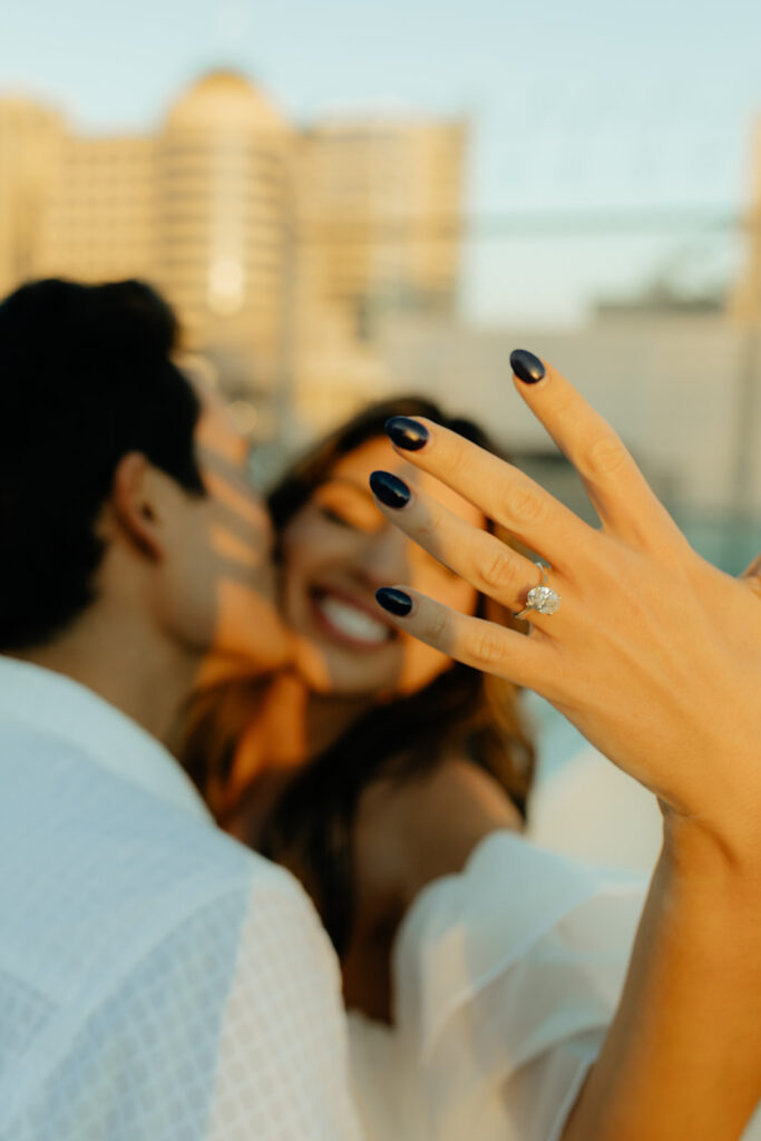 Playful couples rooftop downtown engagement photos in Sacramento
