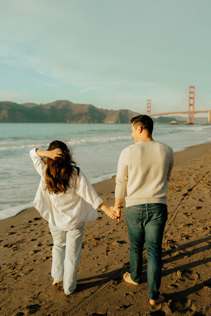 Couples maternity pictures on Bakers Beach in San Francisco, California