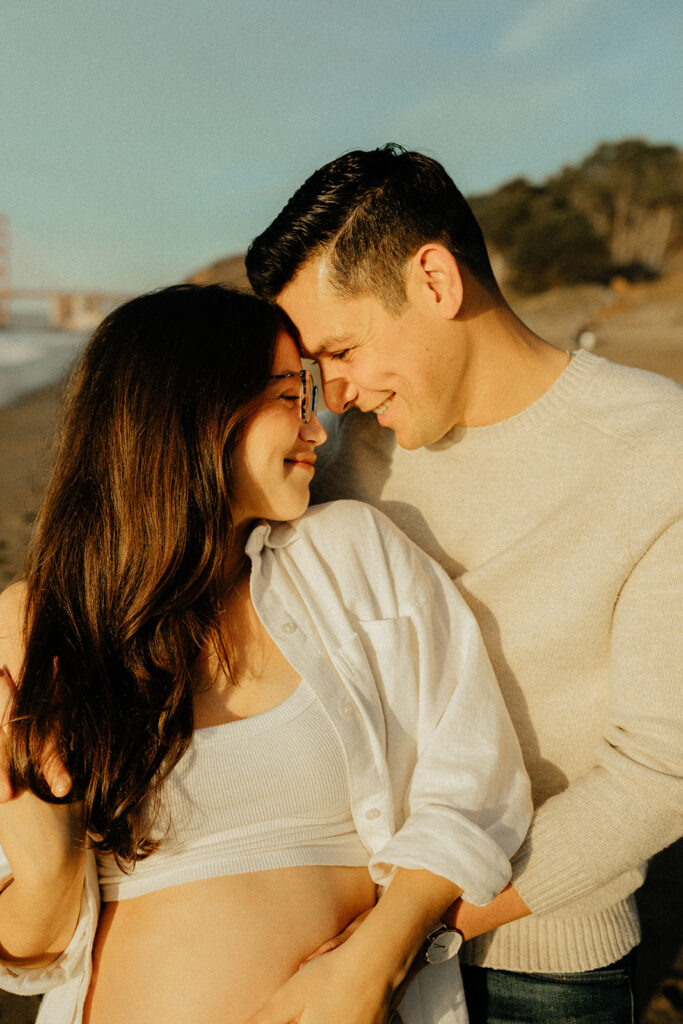Couples maternity pictures on Bakers Beach in San Francisco, California