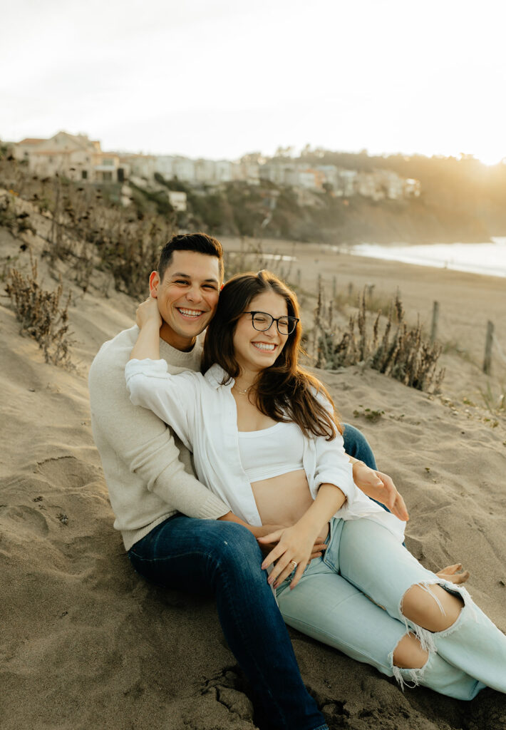 Couple sitting in the sand