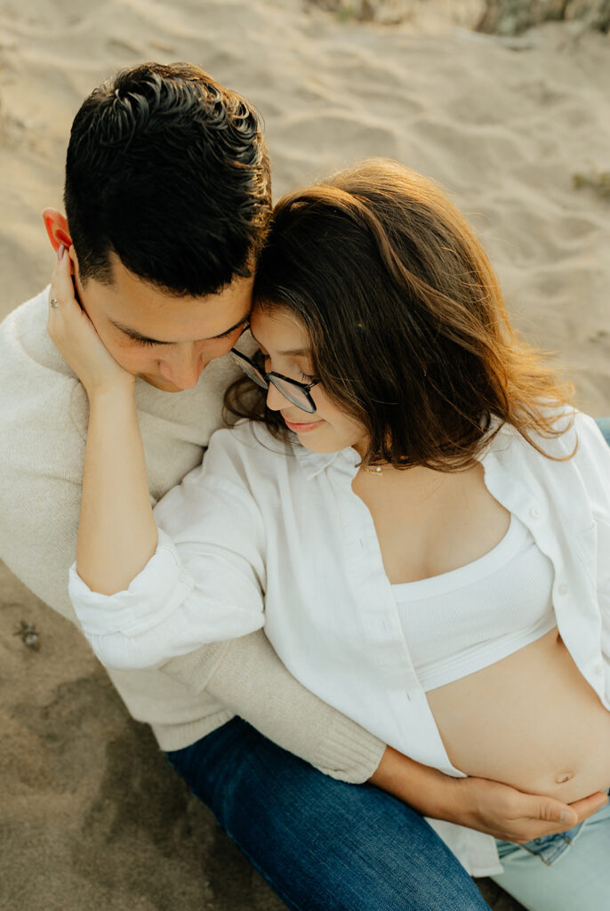 Couple sitting in the sand