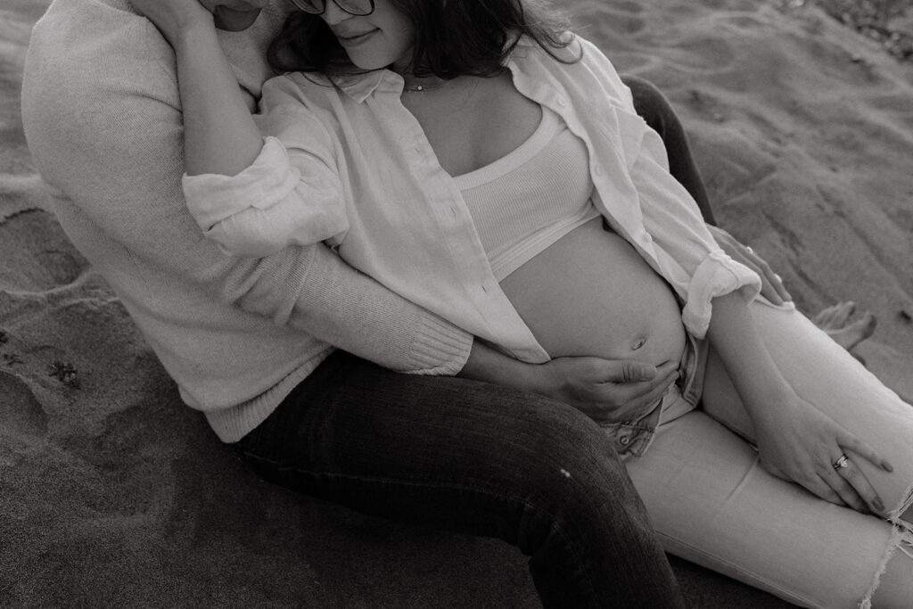 Couple sitting in the sand