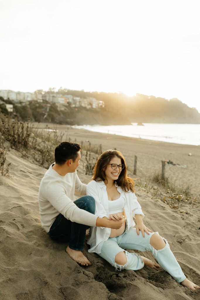 Couple sitting in the sand
