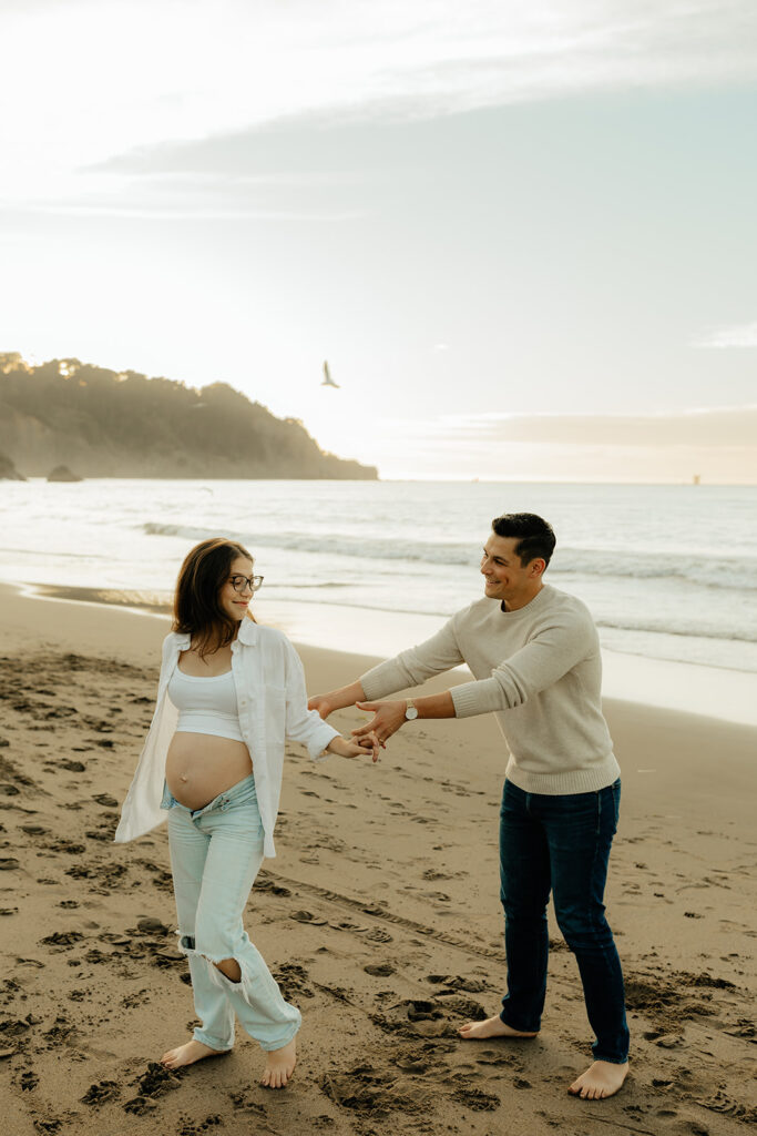 Couples maternity pictures on Bakers Beach in San Francisco, California