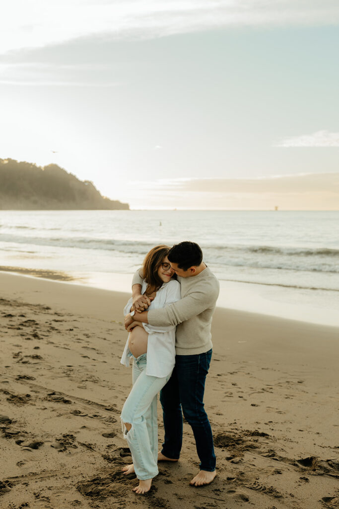 Couples maternity pictures on Bakers Beach in San Francisco, California
