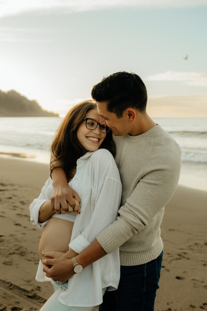 Couples maternity pictures on Bakers Beach in San Francisco, California