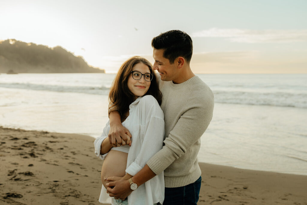 Couples maternity pictures on Bakers Beach in San Francisco, California