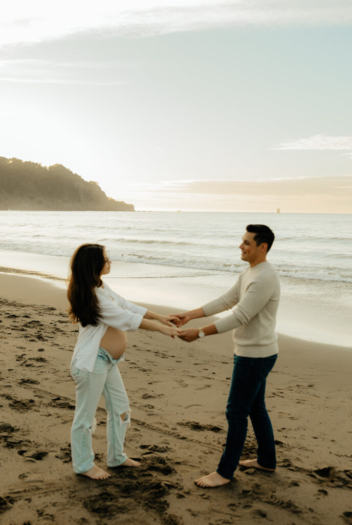 Couples maternity pictures on Bakers Beach in San Francisco, California