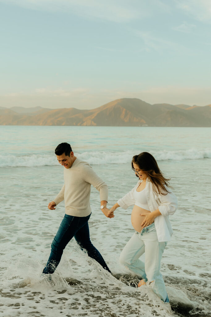 Couples maternity pictures on Bakers Beach in San Francisco, California