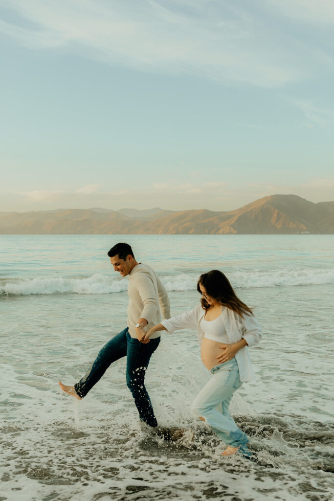 Couples maternity pictures on Bakers Beach in San Francisco, California