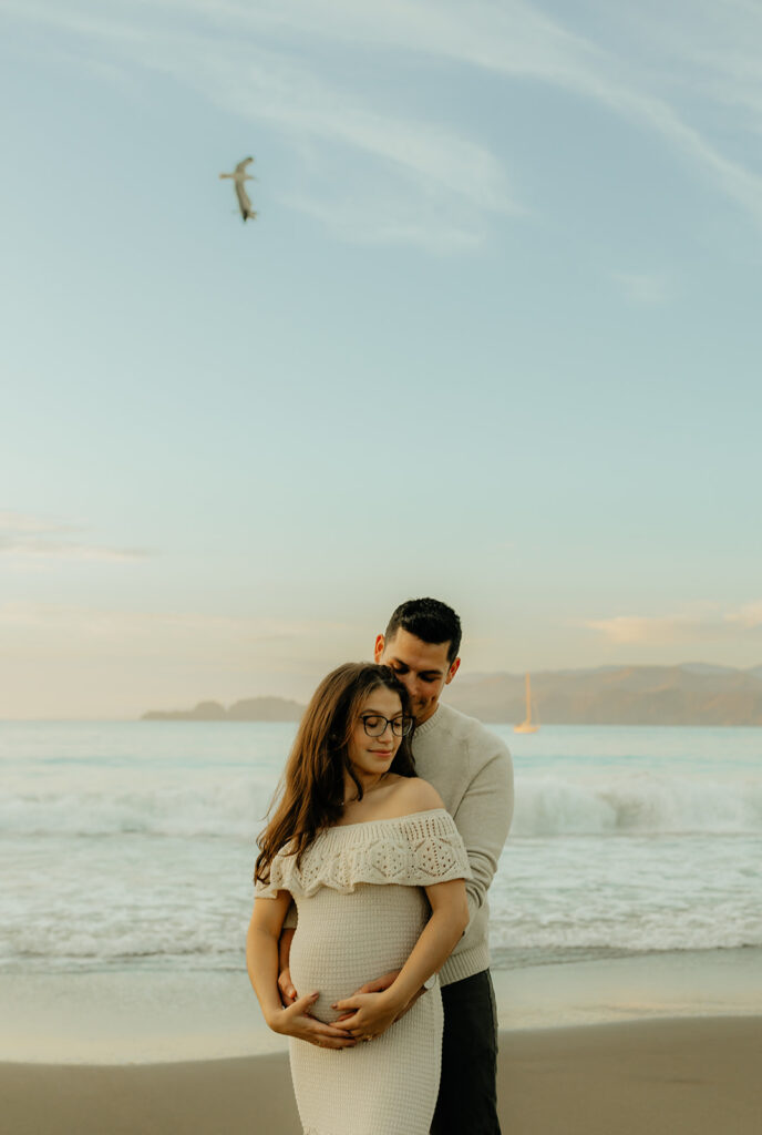 Couples maternity pictures on Bakers Beach in San Francisco, California