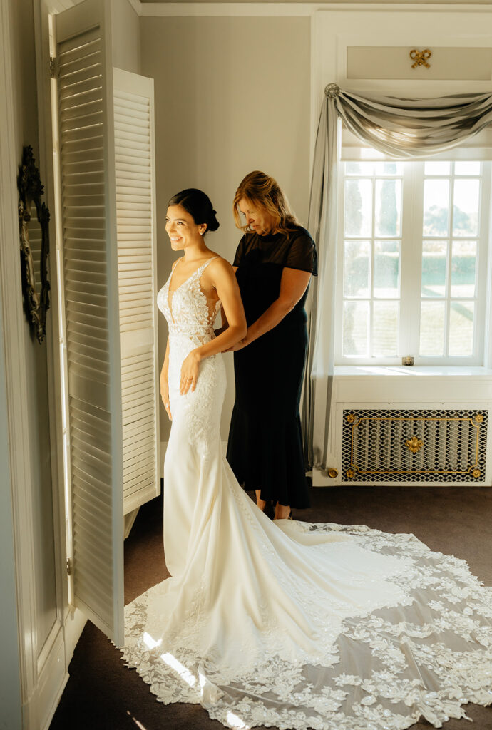 Bride admiring wedding dress