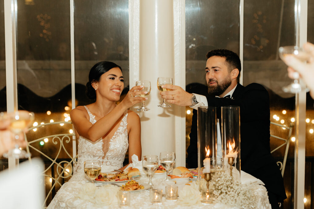 Bride and groom at sweetheart reception table